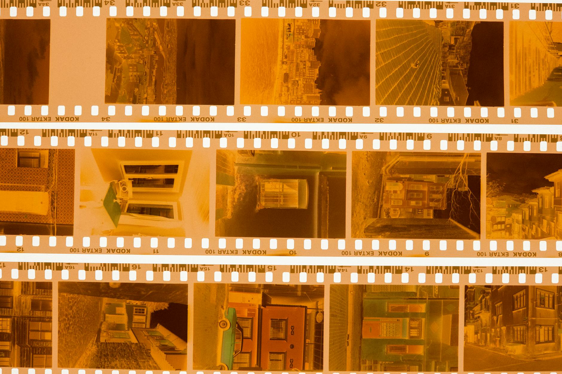 Close-up of vintage Kodak film negatives on a light table, showcasing nostalgic photographic captures.