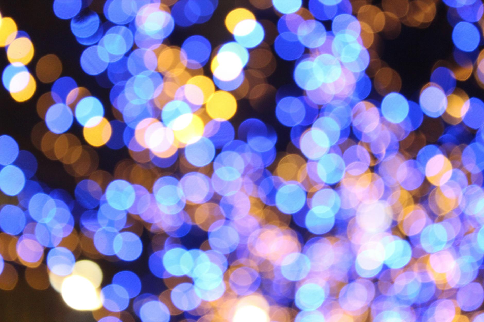 Colorful bokeh lights forming an abstract pattern. Perfect for festive or artistic backgrounds.