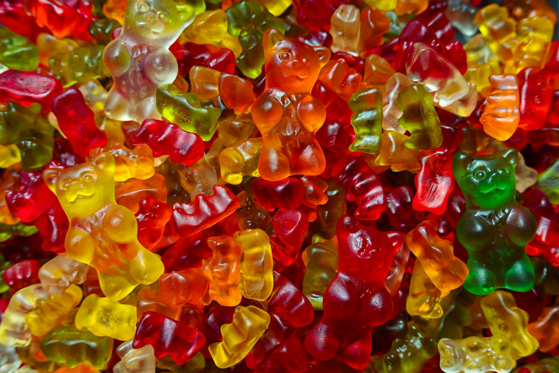 Vibrant close-up of multicolored gummy bears, perfect for candy lovers.