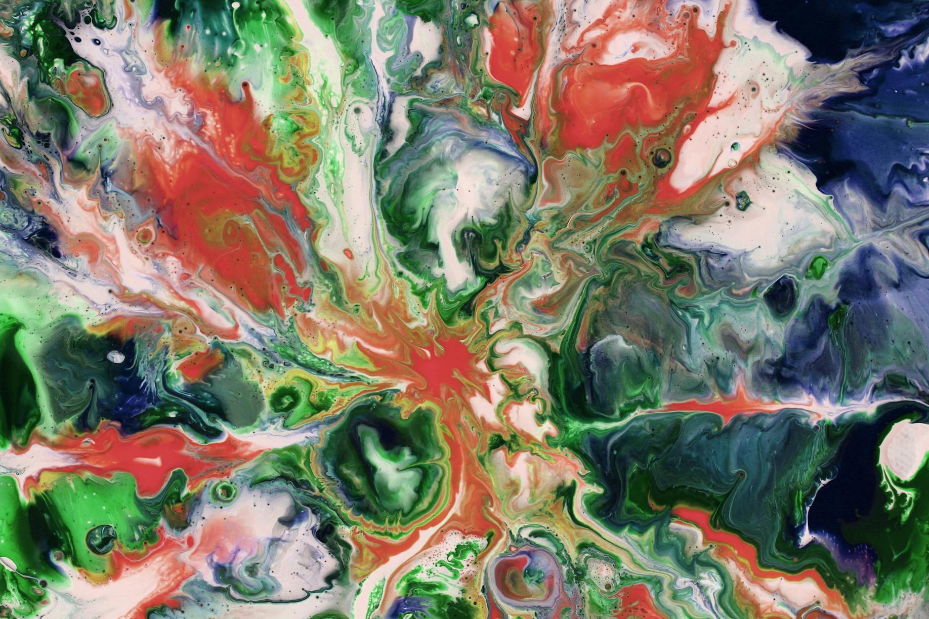 Colorful fluid art painting featuring dynamic swirls of green, red, and blue shades.