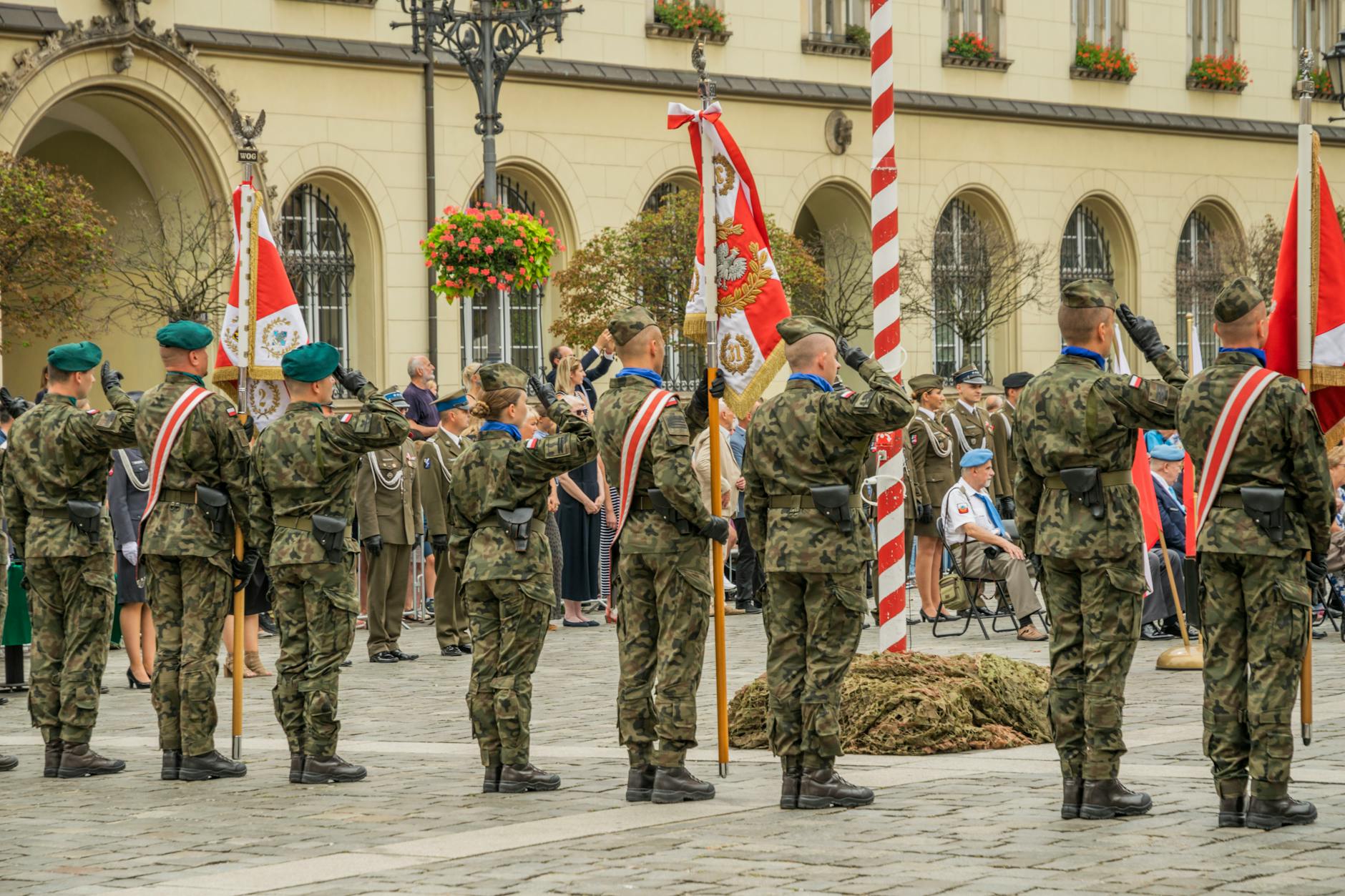 Polish soldiers in military uniforms at a formal parade in Wrocław, showcasing national pride and ceremonial display.