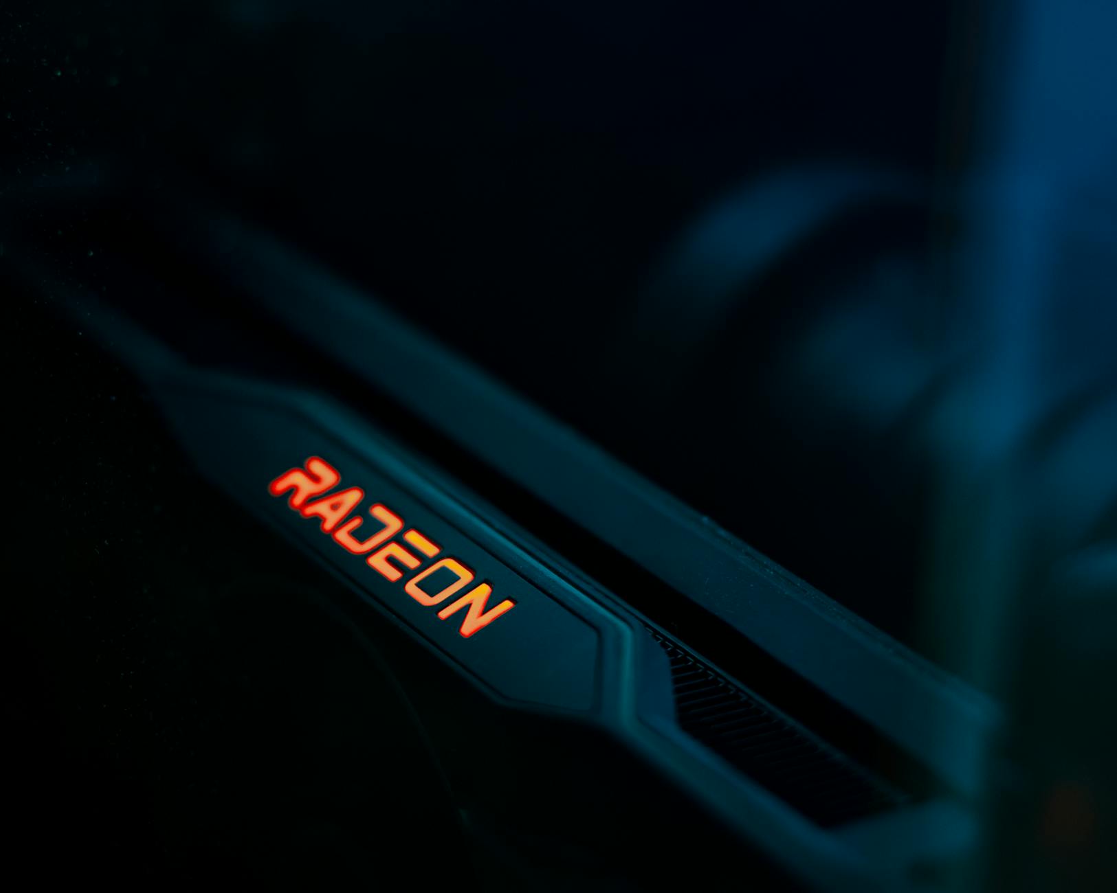 Detailed view of a glowing Radeon graphics card highlighting its hardware design.