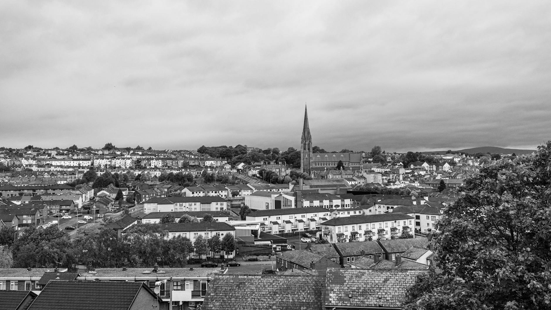 Monochrome aerial view of Londonderry showcasing its historic cityscape.
