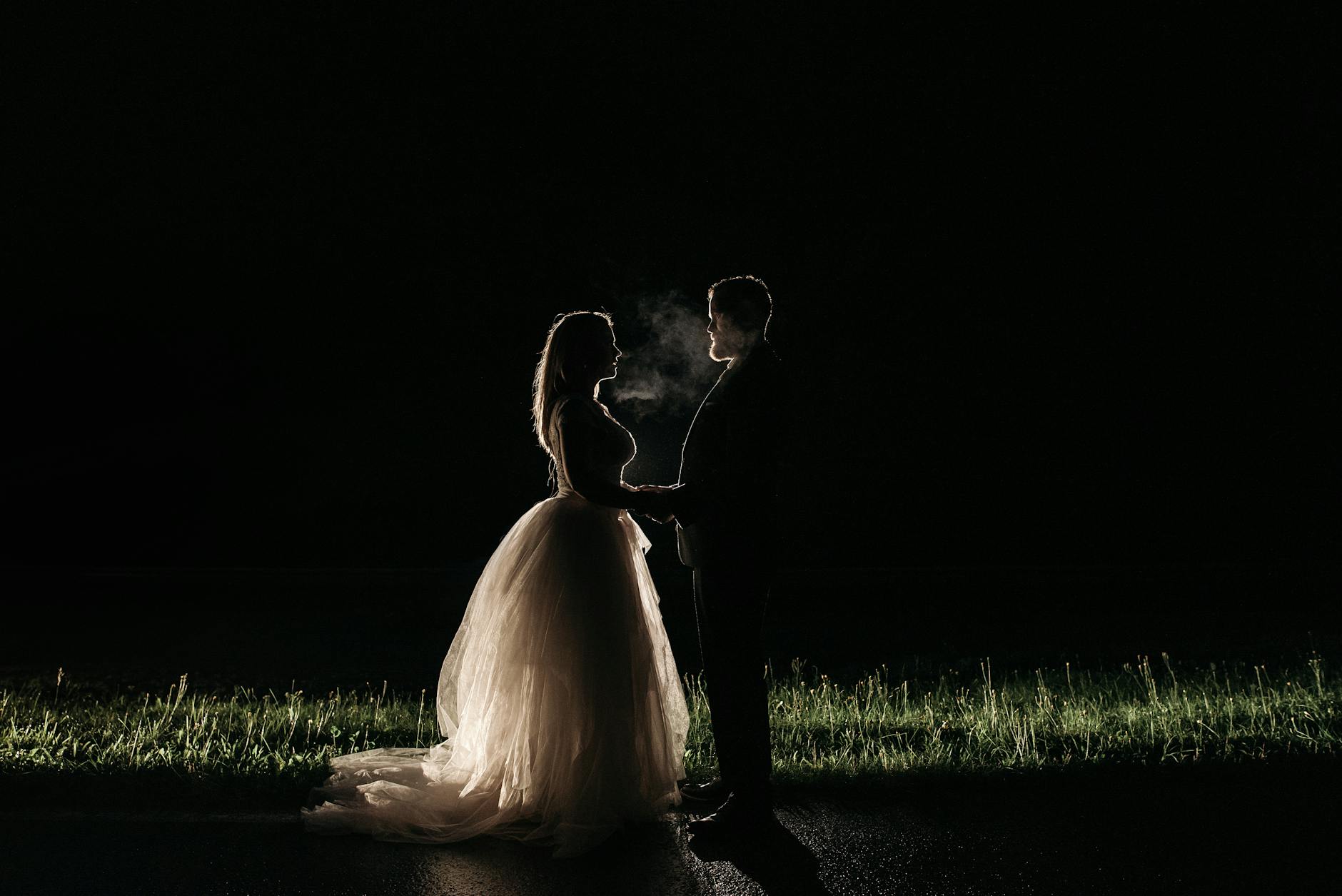 An enchanting silhouette of a couple at night, capturing romance and intimacy.